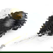 Inuit Hunter by Michael Massie: Canadian. Soapstone. A soapstone sculpture of an Inuit hunter with a spear by Michael Massie, Labrador. Carved in soapstone with the head and face carved in bone as a separate piece and mounted on a