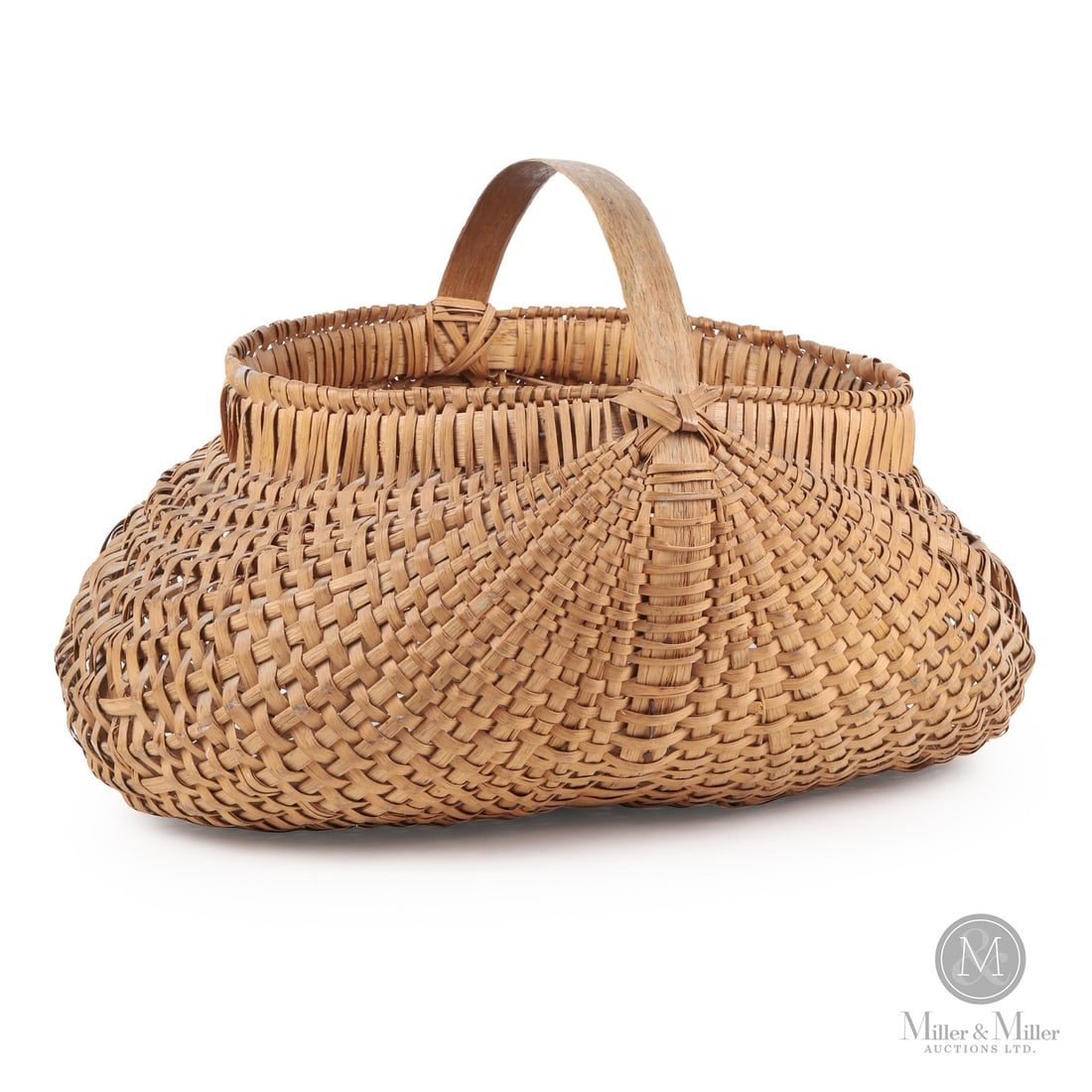 Large Buttocks Basket: Canadian. Wood splint. A splint "buttocks" basket with great form, condition, and size. 19th century. 15.5" x 25" x 21". From the Jon and Lyne Dellandrea Collection. Canadian. A splint "buttocks"
