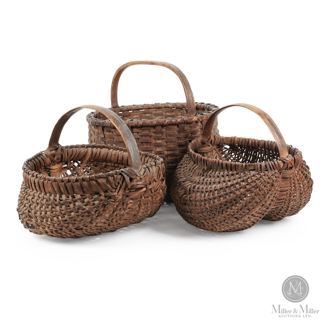 Trio of early Baskets: Canadian. Wood splint. A lot of three 19th-century baskets, including a buttocks basket with great form and patina, minor losses, a second buttocks basket with good patina but with losses to the rim