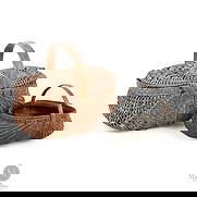 Two woven baskets: Canadian. Wood splint. A lot of two baskets, including a small, finely woven 19th-century buttocks basket in an original oxidized green (near black) paint. Displays well, the rim is intact, and the