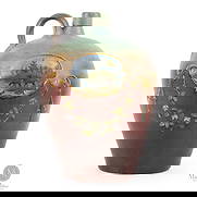 Ovoid Jug with "Adirondack" Scenes: British. Ceramic. An ovoid redware jug having exquisitely painted "Adirondack" scenes, with one side showing a hunter standing beside his canoe, blowing a moose call, while the other side has a