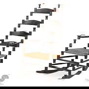 Early Mushroom Arm Rocker: Canadian. Wood. An early slat back rocking chair with split baluster arms and mushroom cap posts. Very good condition with a replaced rush seat, and the rockers have been "rounded out" due to