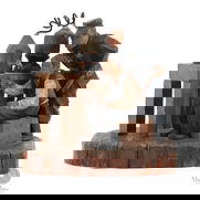 Folk Art Carving Prohibition scene: Canadian. Wood. A folk art sculpture of a prohibition scene carved and painted in the manner of the Trygg family. The scene shows a man at his still, testing quality, while a policeman looks over his