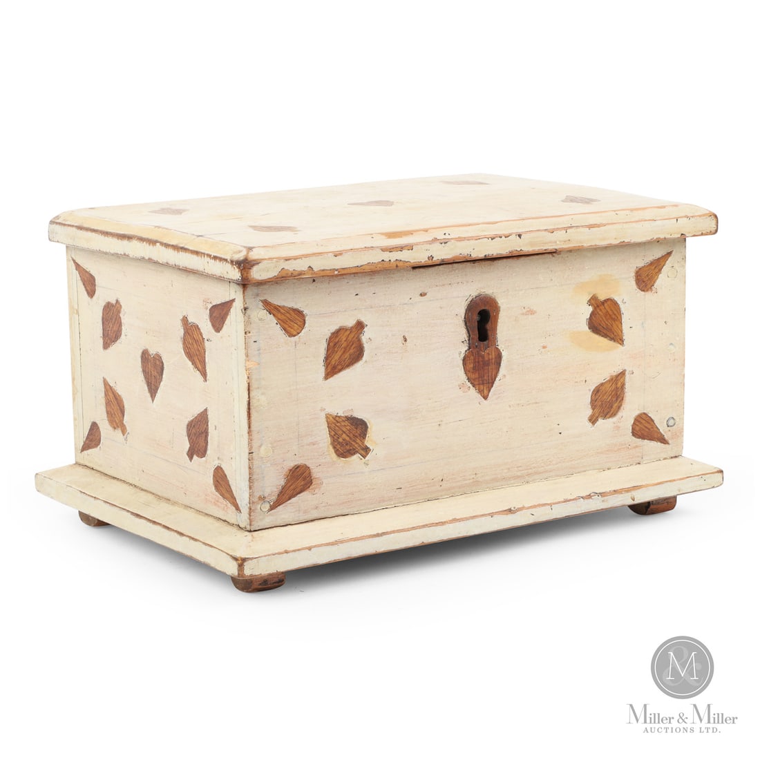 Deed Box with Inlaid Hearts and Spades: Canadian. Wood. A deed box in cream paint with inlaid hearts and spades on the top and sides, and a shamrock on the back, as well as having a bevel base molding, original lock, and cast butt hinges.