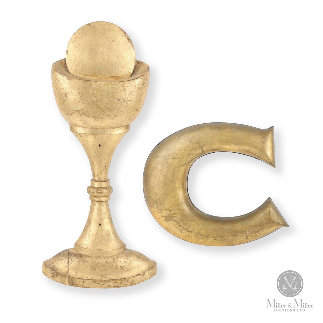 Carved Monstrance and letter "C": Canadian. Wood. Lot of two, including a carved pine monstrance from a Quebec country church in original gilt surface and in very good condition. Also included is a carved letter "C" in gold paint