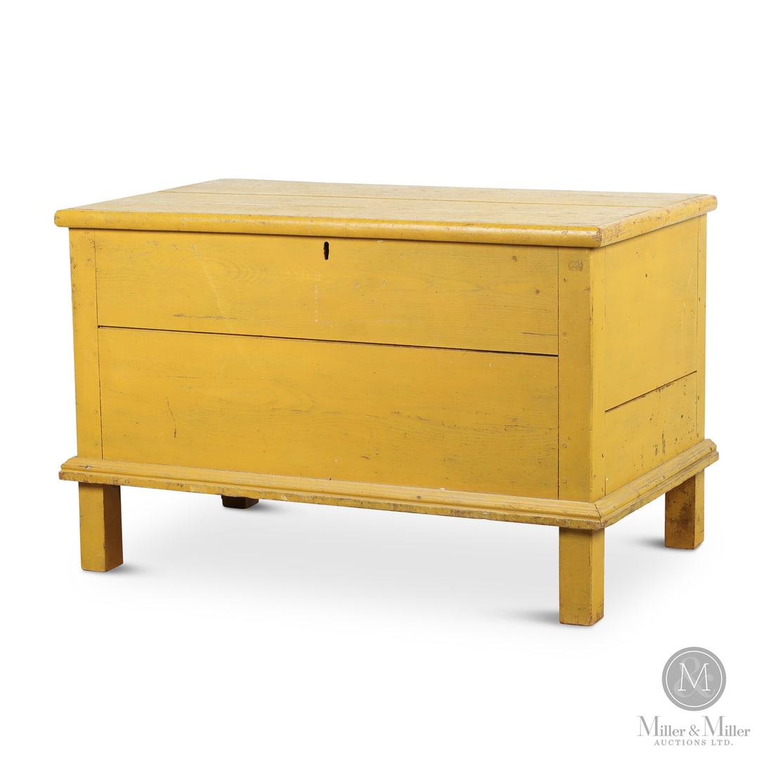 Yellow Blanket Chest: Canadian. Wood. A Quebec blanket chest in original yellow paint with post construction and high feet. Constructed in ash and pine, having a splined top, original moldings, butt hinges, and the