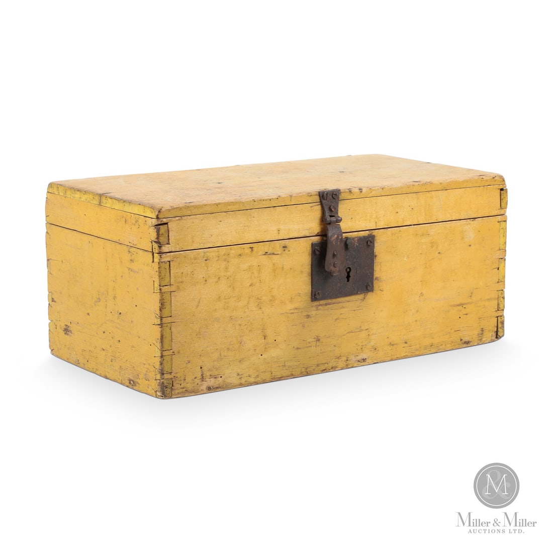 Yellow storage box: Canadian. Wood. A flat top, dovetailed pine storage box in original yellow, retaining the original hasp, lock, and cast butt hinges. Good condition. Mid-19th century. 7" x 16.75" x 8.75". From the