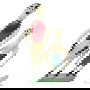 Charlie Tanner Man & Boy on Base: Charlie Tanner's (1914-1992) unique style of carving featured bulbous human figures with elongated arms. This example earlier and less refined compared to his later carvings.