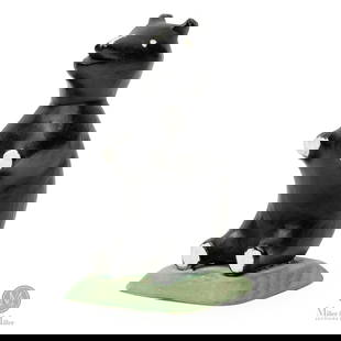 Charlie Tanner Small Dog: The black dog is frequently seen in Charlie Tanner's (1914-1992) group carvings. The truncated limbs are typical of Tanner's work.