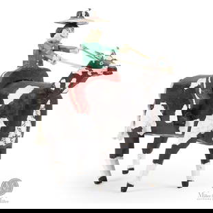 Leo Naugler Man on Horse Carving: The carving from Leo Naugler's (1956 - ) earlier career depicts a rider enthusiastically pullings the reins. The horse is about all he can handle.