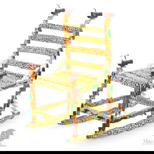 Leo Naugler Chair: Creatures are a major part of Leo Naugler's (1956 - ) repertoire and here he creatively places them on a carved and brightly coloured rocking chair. The finials are brown ducks, and a fish swims