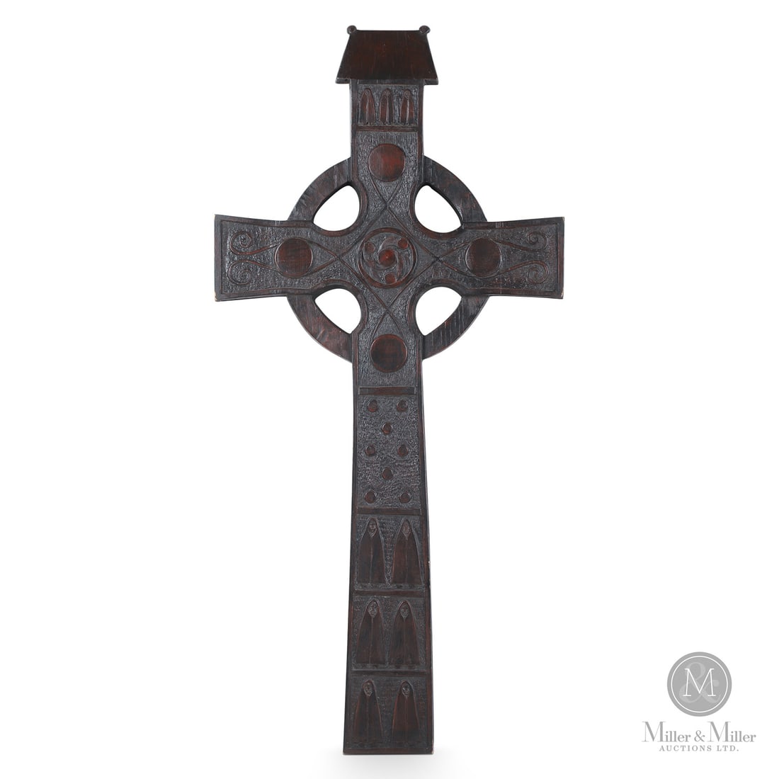 Robert Wylie Celtic Cross: Typically carved in basswood, Wylie's (1932-) works are highly finished with polished monochromatic surfaces featuring animals, angels, crosses. This is a large well-carved Celtic cross with numerous