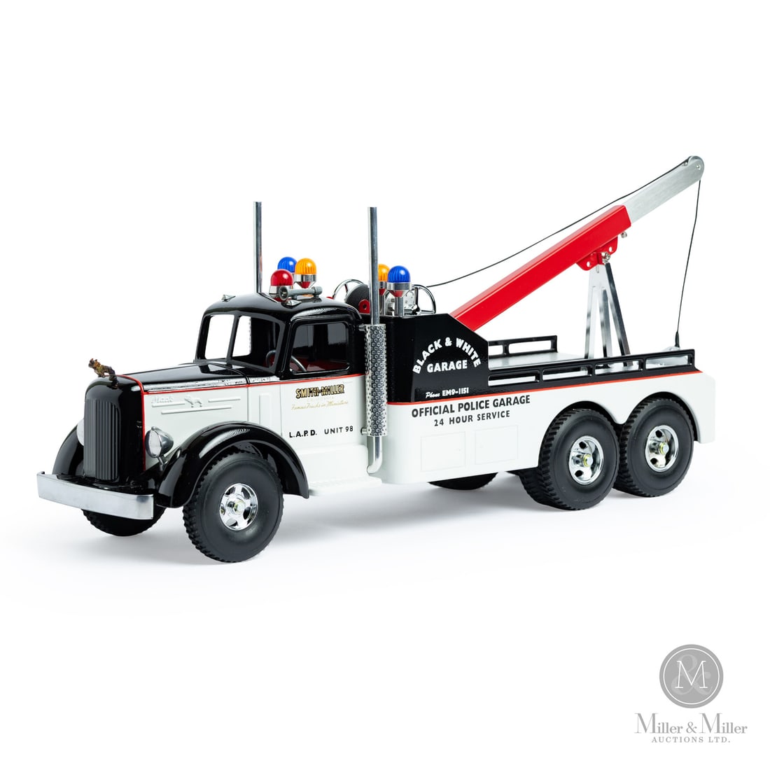 Fred Thompson Limited Edition Smith-Miller Black and White Police Garage L MACK Tow Truck (147/225): American. Late 1980s-Early 1990s. Pressed steel. Fred Thompson was a long-time collector of Smith-Miller toys. In 1979, over 20 years after Smith-Miller ceased toy production, Thompson purchased the c