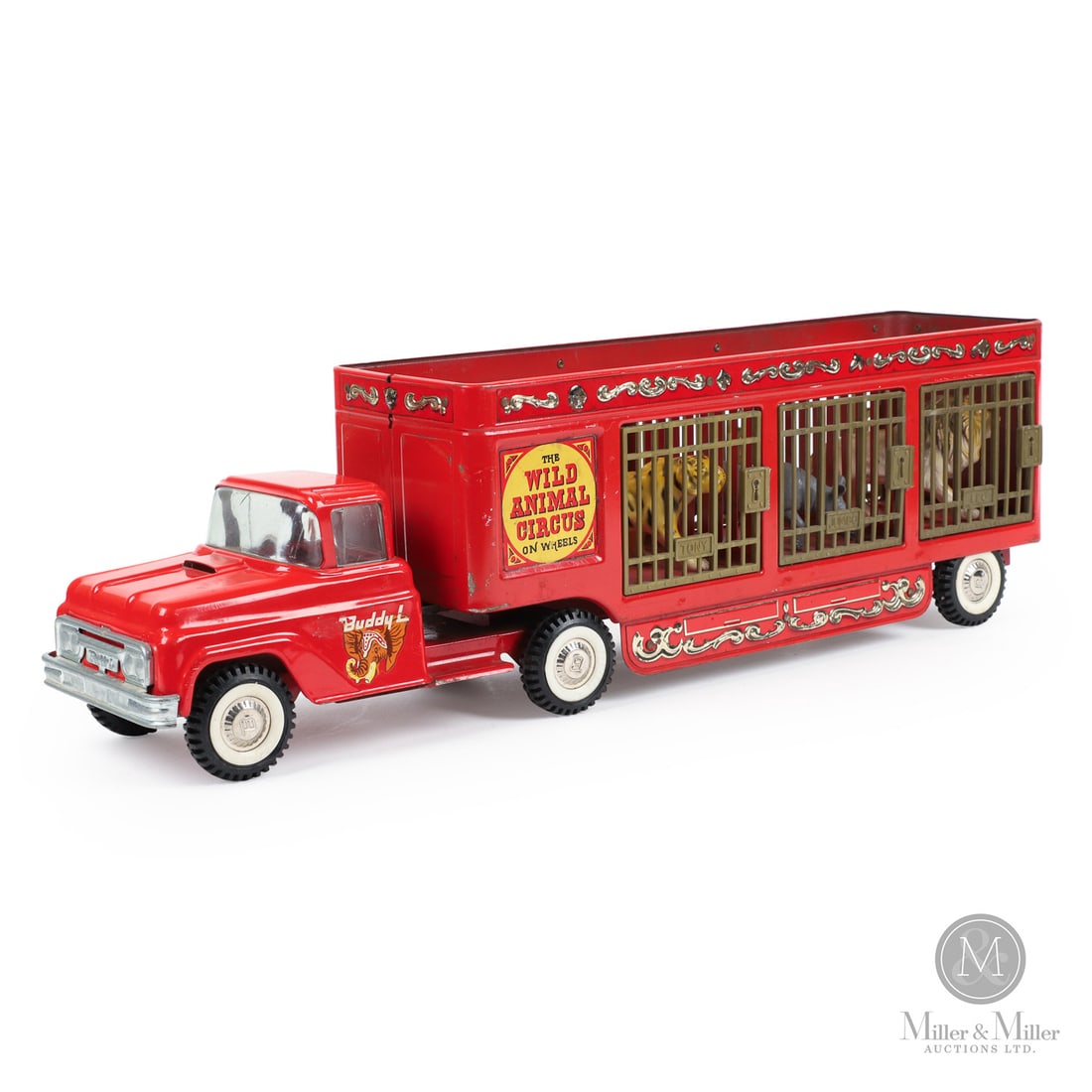 Buddy L "Wild Animal Circus" Tractor Trailer: American. 1960s. Pressed steel, plastic. Marked, "Buddy L", on cab doors and rear panel of trailer. Embossed, "B", on hubcaps. From the Yvan Lalonde Collection.Size7.5" x 5.5" x 25".ConditionVery