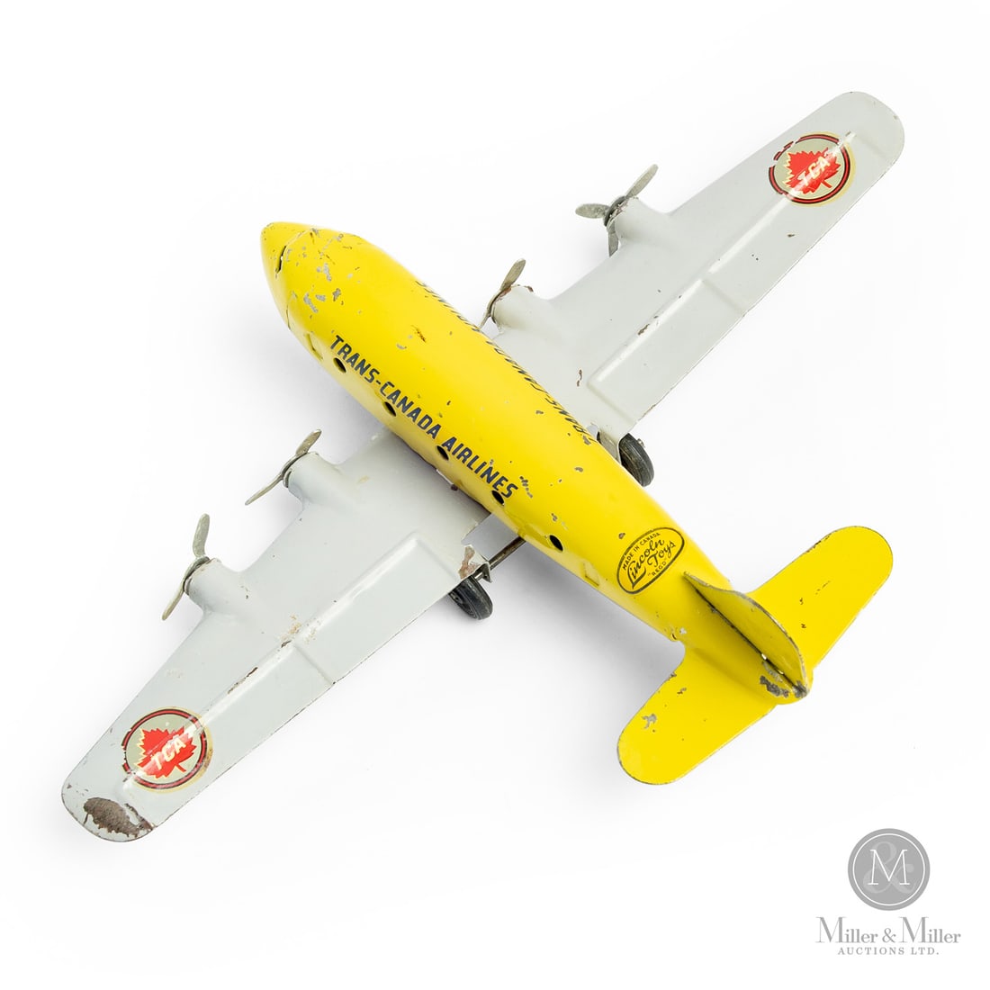 Lincoln Toys Trans-Canada Airlines Airplane: Canadian. 1948-1958. Pressed steel. This toy has a decal that says "Made in Canada Lincoln Toys Reg'd," which identifies Lincoln toys that were made from 1946 to the early 1950s, representing the form