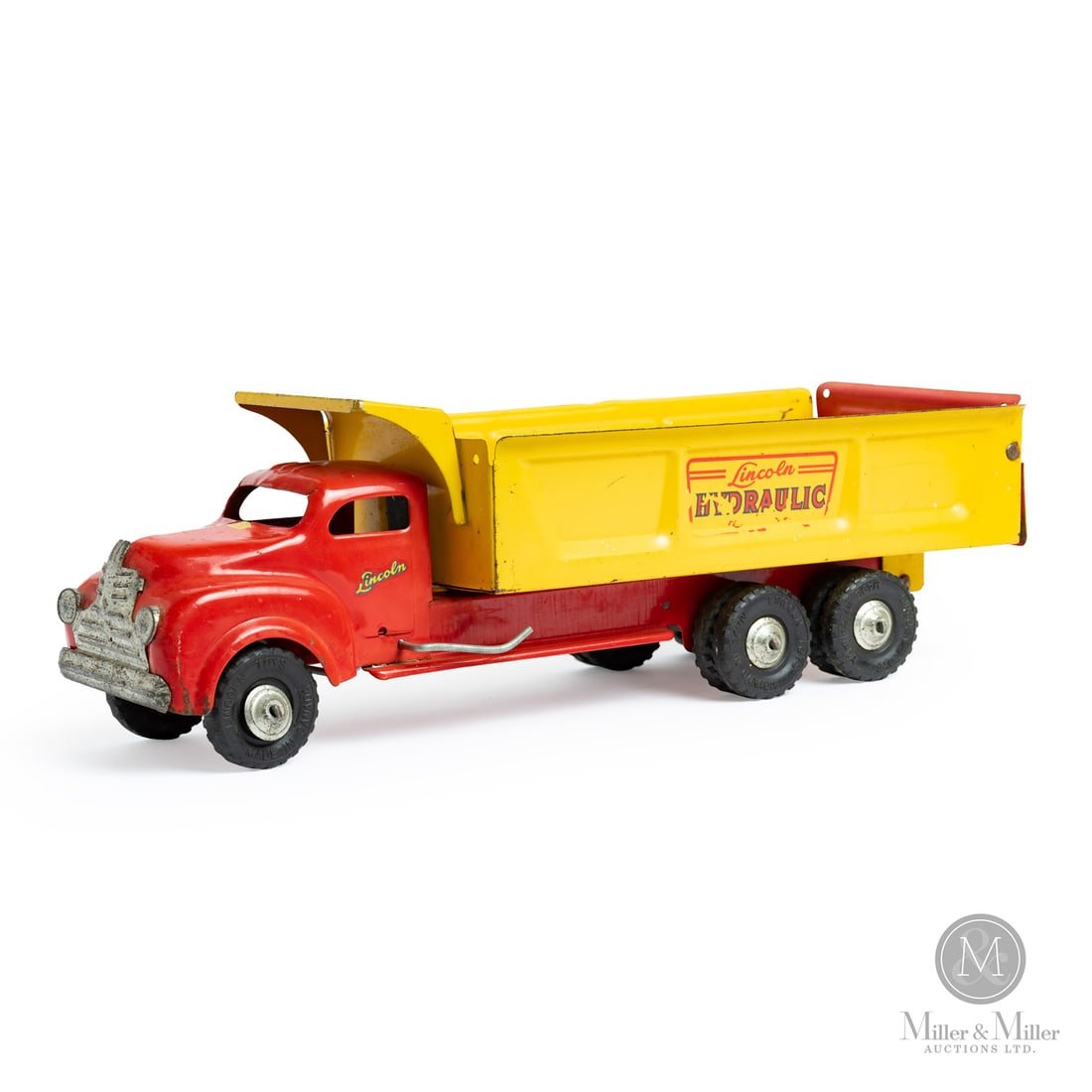 Lincoln Toys "Hydraulic Action" Truck: Canadian. 1946-1948. Pressed steel. This toy has a decal that says "Made in Canada for Lincoln Toys," which identifies Lincoln toys that were made during the brand's earliest production years (1946-19