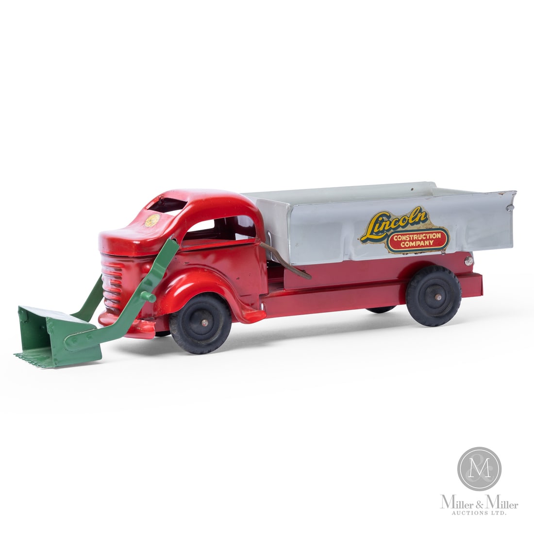 Lincoln Toys "Lincoln Construction Company" Bulldozer Dump Truck: Canadian. 1950s. Pressed steel. Lincoln Construction Company was a fictional identity used by Lincoln Specialties to give their construction-themed toys a professional, industrial look. This bulldozer