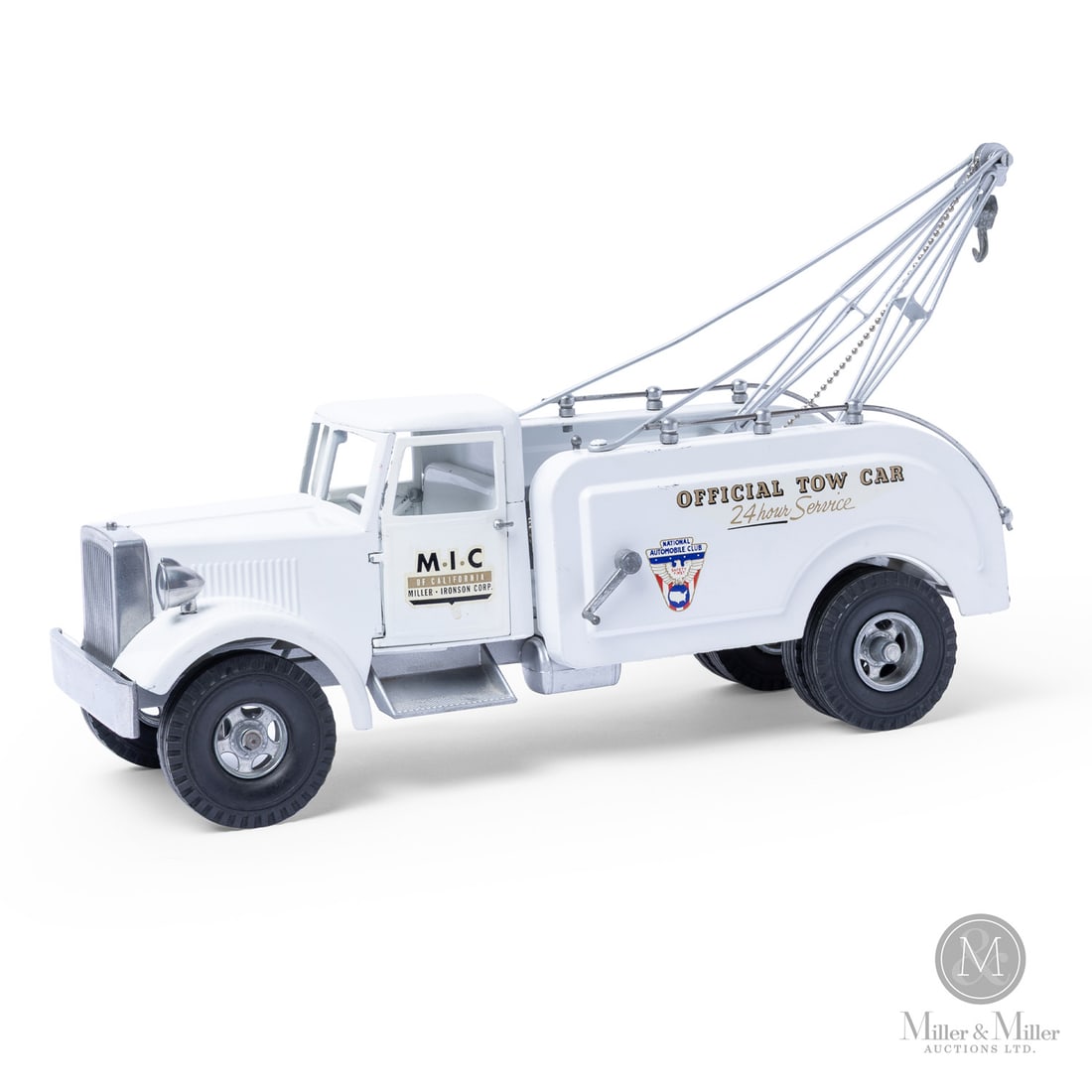 Miller-Ironson (Smith-Miller) "M.I.C. Official Tow Car" Tow Truck: American. 1952-1955. Pressed steel. This is a rare toy produced by the Miller-Ironson Corp. ("MIC"), a company that was formed by Matt Miller when he left Smith-Miller in 1952. The new company was a