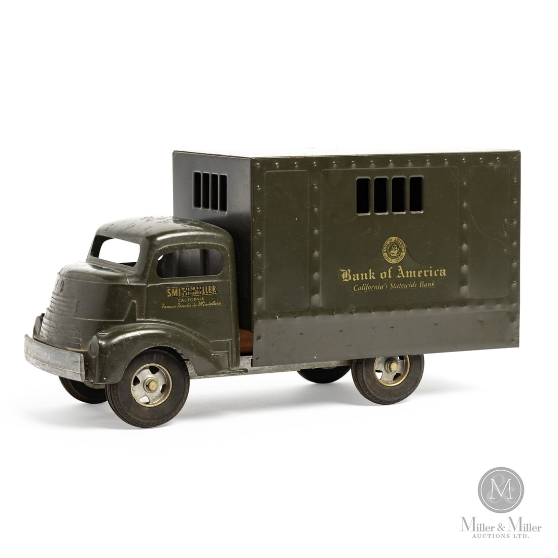 Smith-Miller Bank of America Truck: American. 1949-1952. Pressed steel. This toy has an unusual mark on the chassis, an "H" casting identity mark with some embellishments. When Bob Smith left Smith-Miller, Matt Miller was looking for a