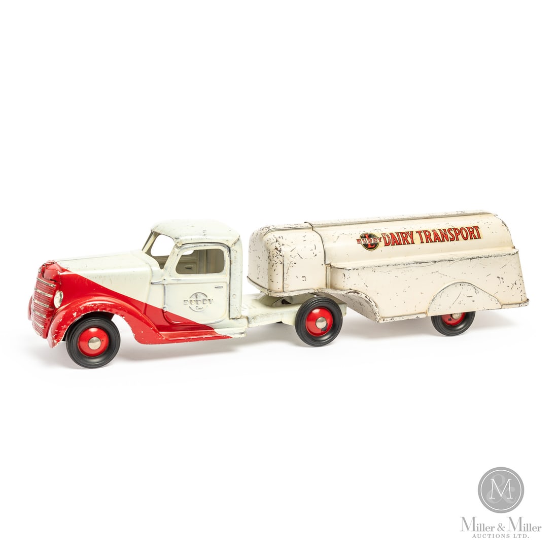 Buddy L Dairy Transport Truck: American. 1930-1932. Pressed steel. This toy was made early on at the outset of the Great Depression (1929-1941). Toys made in this period are often in greater demand than some earlier models,