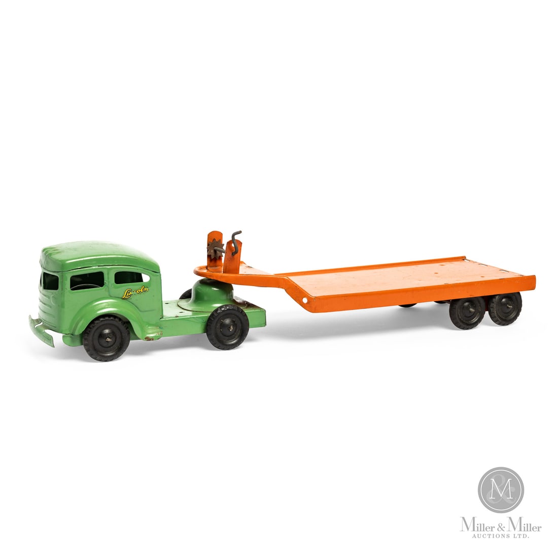 Lincoln Toys Low-Bed Carrier: Canadian. 1940s. Pressed steel. Decalled, "Made By Ellwood Metal Products Tilbury Ont., For Lincoln Toys Made in Canada", at front top of flatbed. Decalled, "Lincoln", on cab doors. From the Yvan Lalo