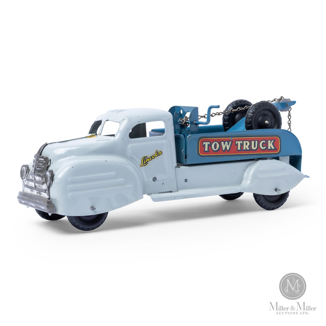 Lincoln Toys Tow Truck (Gray/Blue): Canadian. 1946-1948. Pressed steel. This toy has a label that says only "Made in Canada Lincoln Toys," which identifies Lincoln toys that were made during the brand's earliest production years