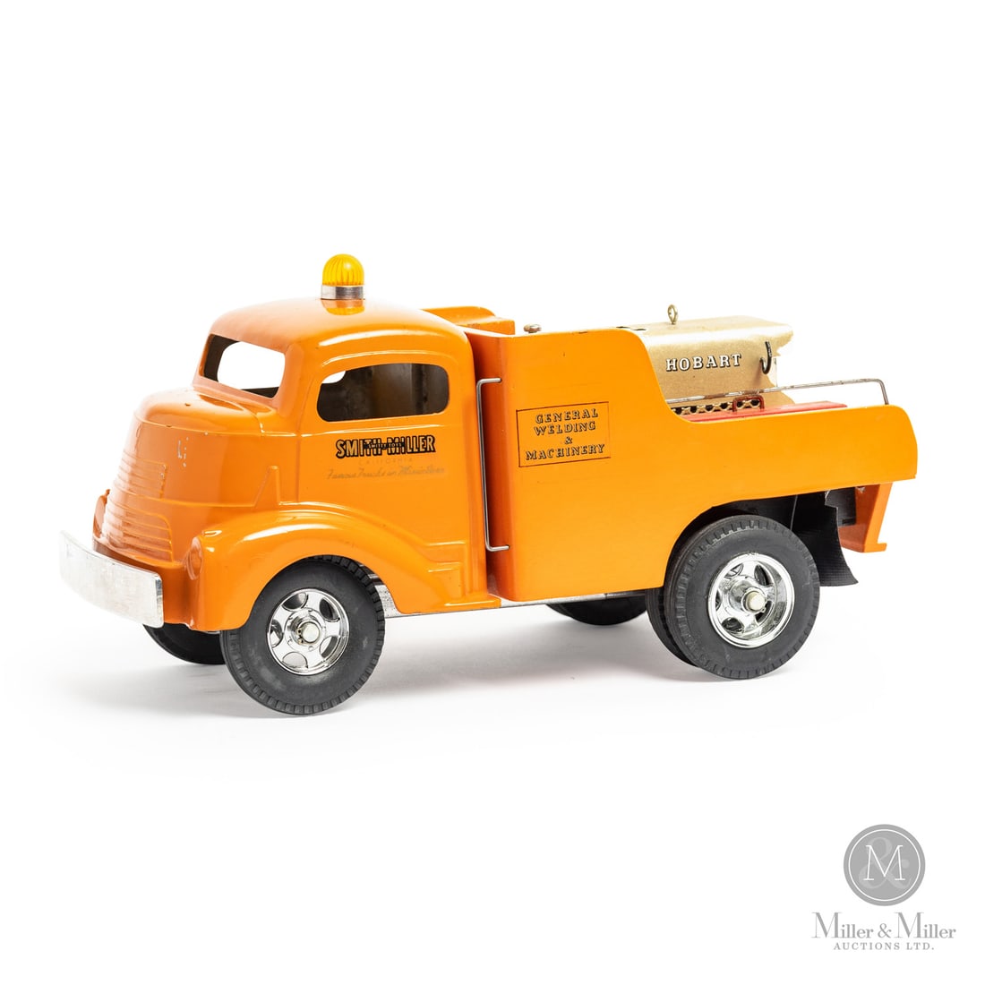 Smith-Miller General Welding & Machinery Truck: American. 1949-1952. Pressed steel. This toy has an unusual mark on the chassis, an "H" casting identity mark with some embellishments. When Bob Smith left Smith-Miller, Matt Miller was looking for a
