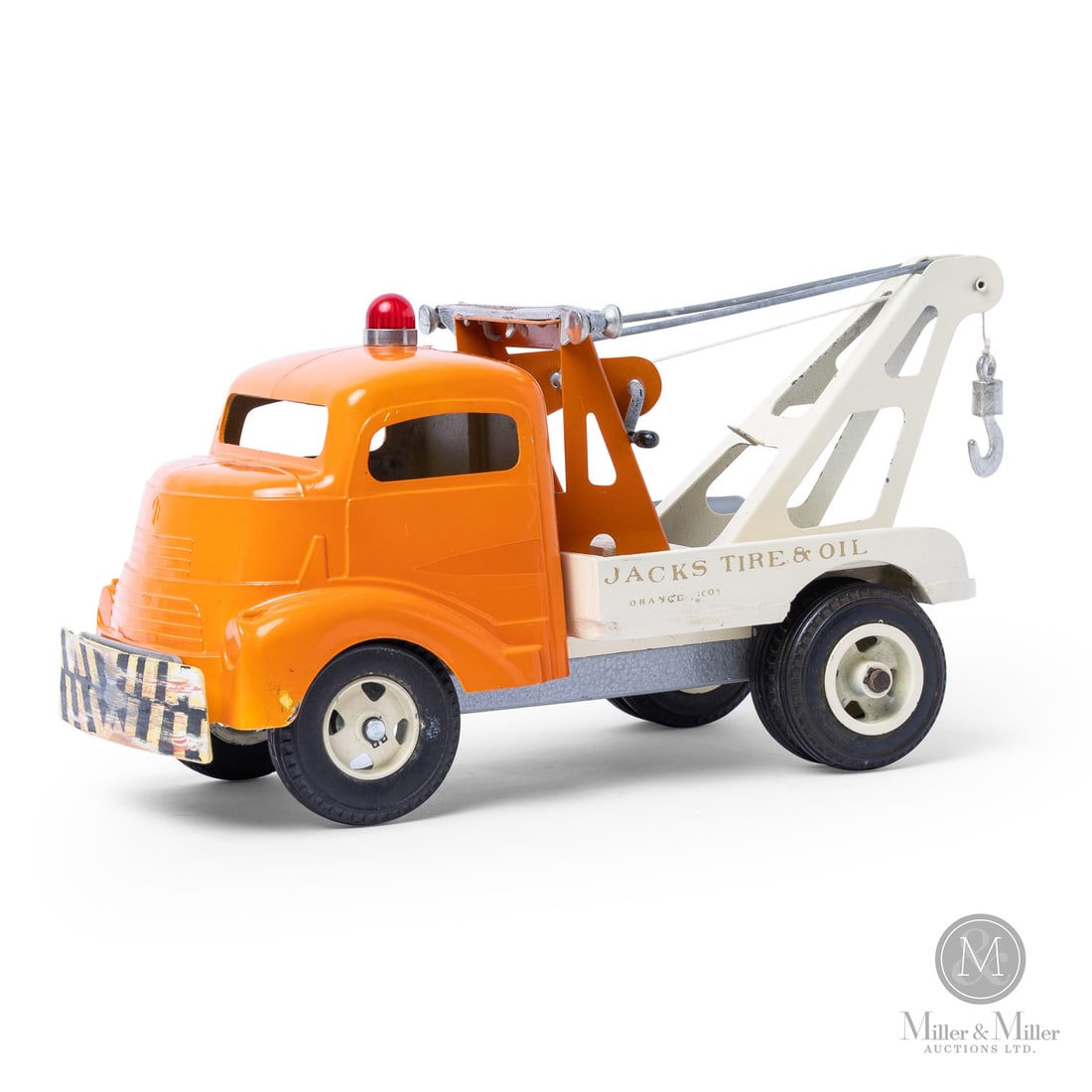 Smith-Miller Wrecker Tow Truck: American. 1945-1955. Pressed steel, cast aluminum. This wrecker advertises "Jacks Tire & Oil," which was a real company that provided commercial and roadside services. The company had various