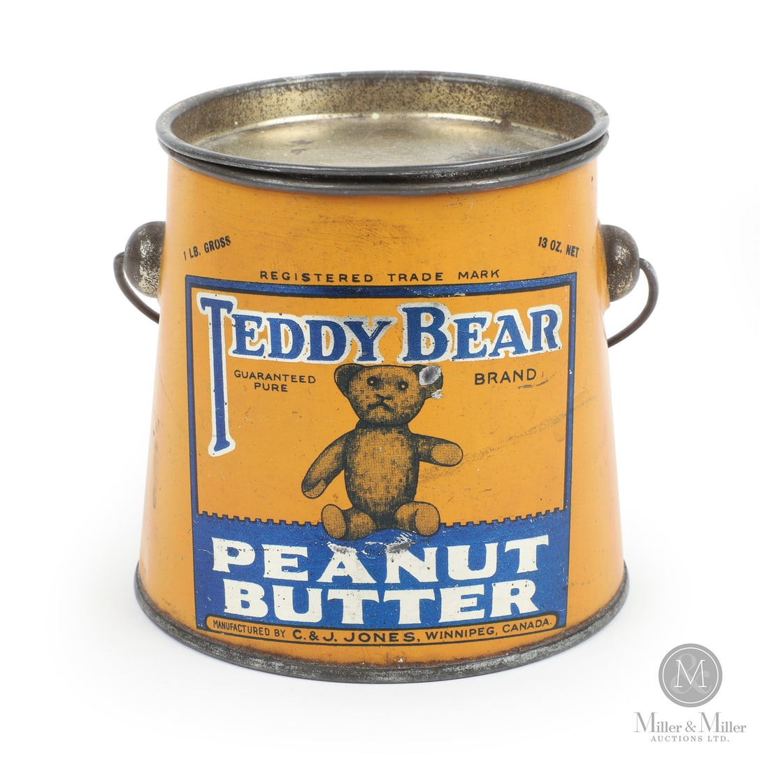 C. & J. Jones, Winnipeg Teddy Bear 1Lb Peanut Butter Tin: Canadian. 1920s. Lithographed tin. Authenticated by The Authentication Company (TAC #501414). All items are guaranteed authentic by Miller & Miller Auctions. Size 3.5" x 4" x 3.75". Condition Excellen