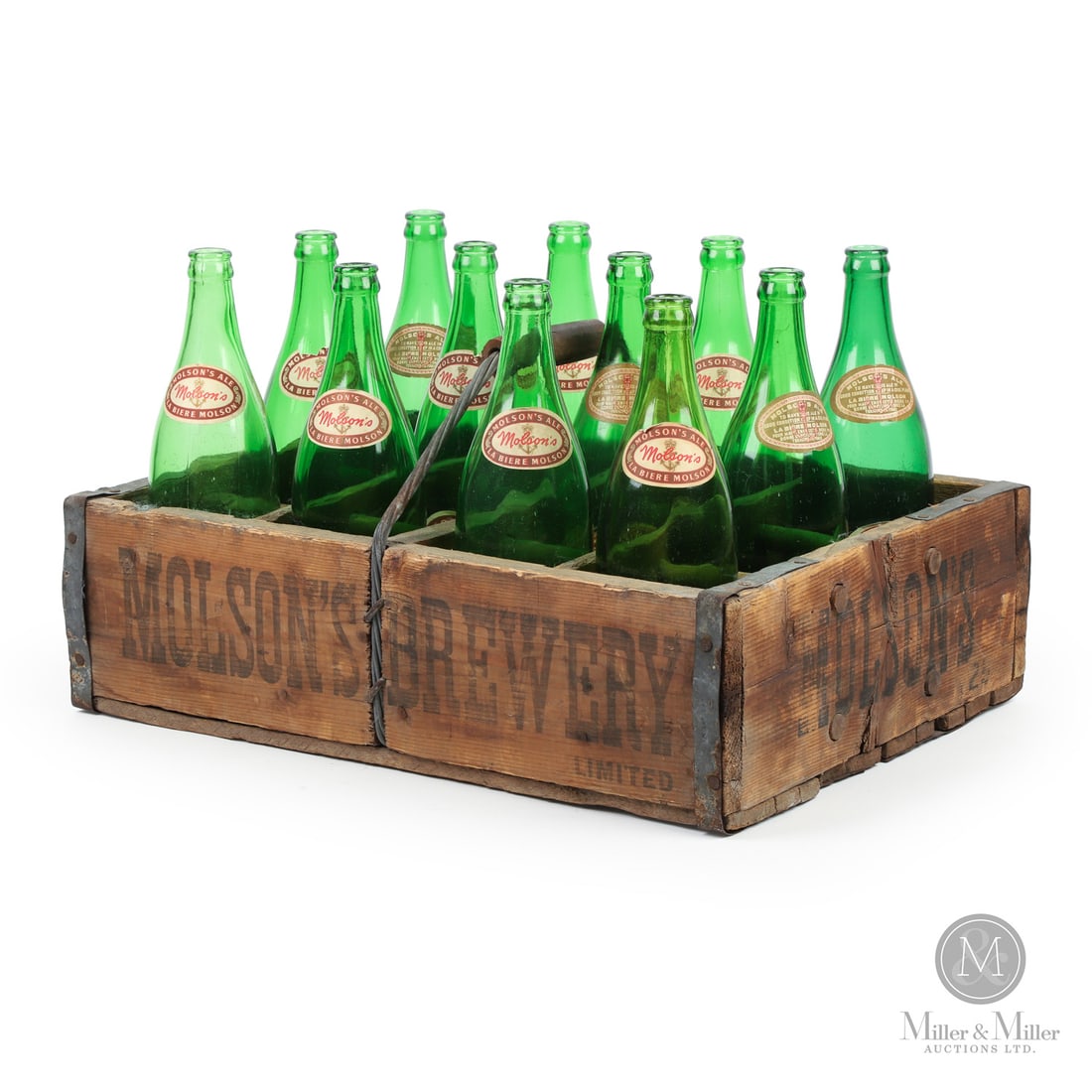Molson's Brewery Twelve Quart Bottle Carrier and Bottles: Canadian. 1920s. Stencilled wood case with glass bottles and applied paper labels. Includes 12 quart paper label and original magazine advertisement. All items are guaranteed authentic by Miller &