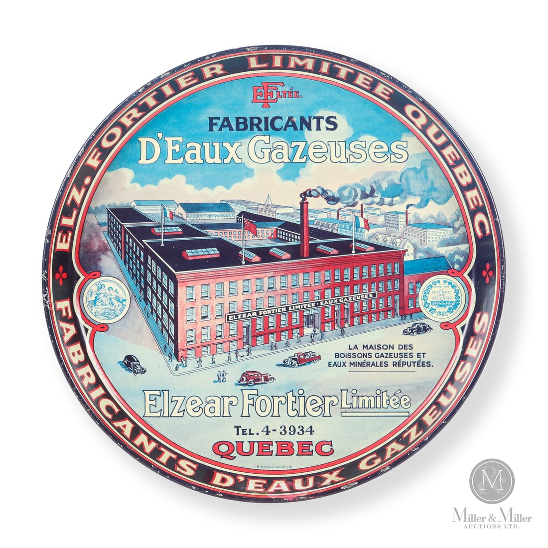 Elzear Fortier D'eaux Gazeuses (Mineral Waters) Serving Tray: Canadian. 1930s. Lithographed tin. Fortier was a large bottler of mineral waters in Quebec. The tray features a detailed image of their busy factory circa 1930. Marked, "The Whittall Can Co Ltd.",