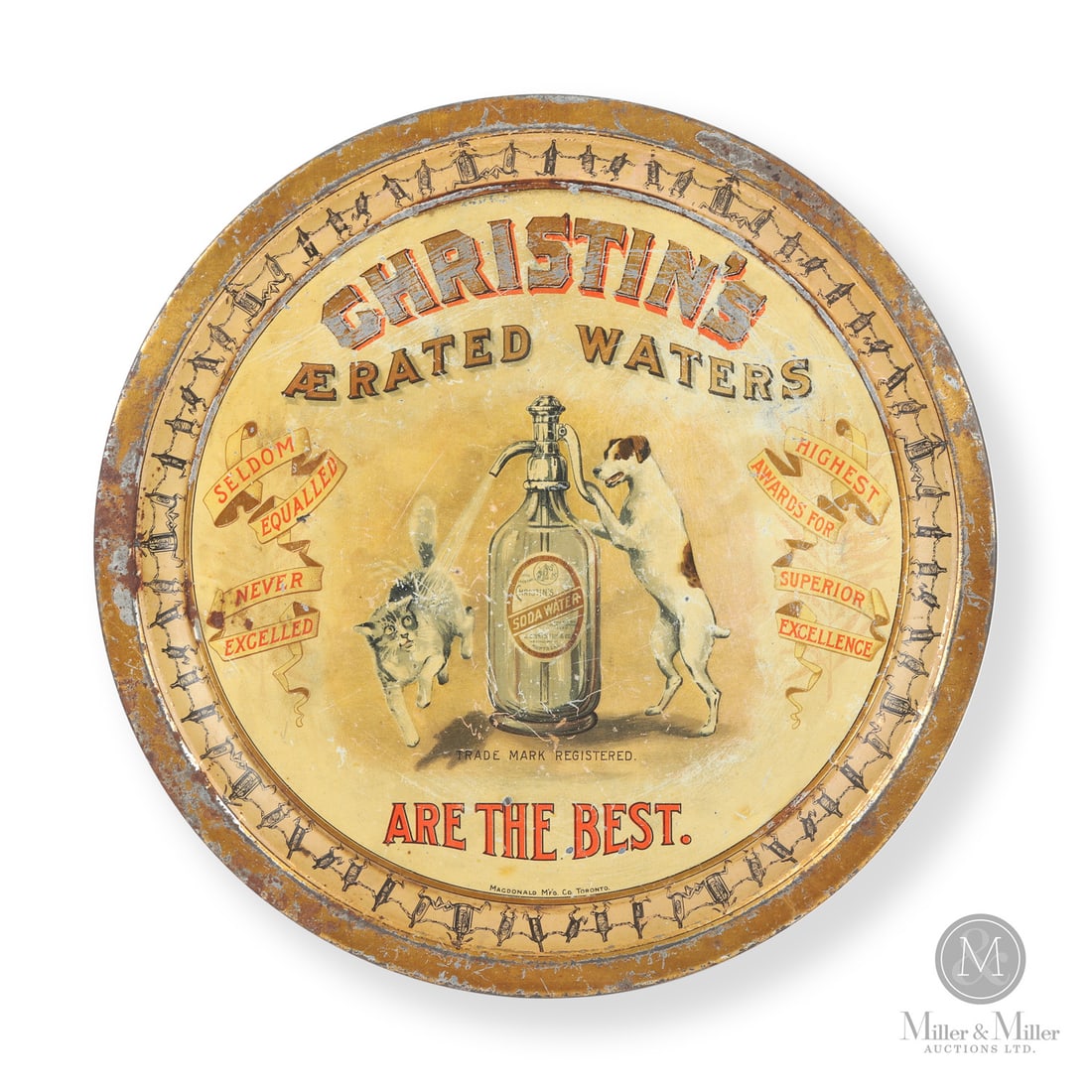 Christin's Aerated Waters Serving Tray: Canadian. 1910s. Lithographed tin. Featuring a playful image of dog spraying a cat with a labelled seltzer bottle. Marked, "Macdonald Mfg Co., Toronto", lower inside edge. Authenticated by The Authent