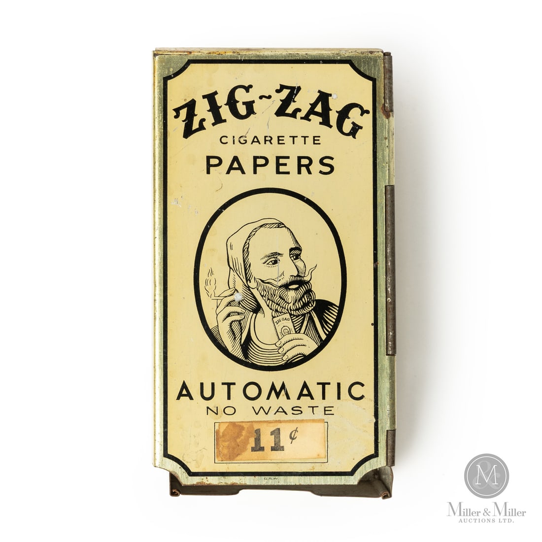 Zig-Zag Cigarette Paper Dispenser: Canadian. 1930s. Lithographed tin. Zig Zag cigarette papers were named for the "Z" shape of the tobacco leaves, which were folded in two and interleaved (alternately placed between one another) as