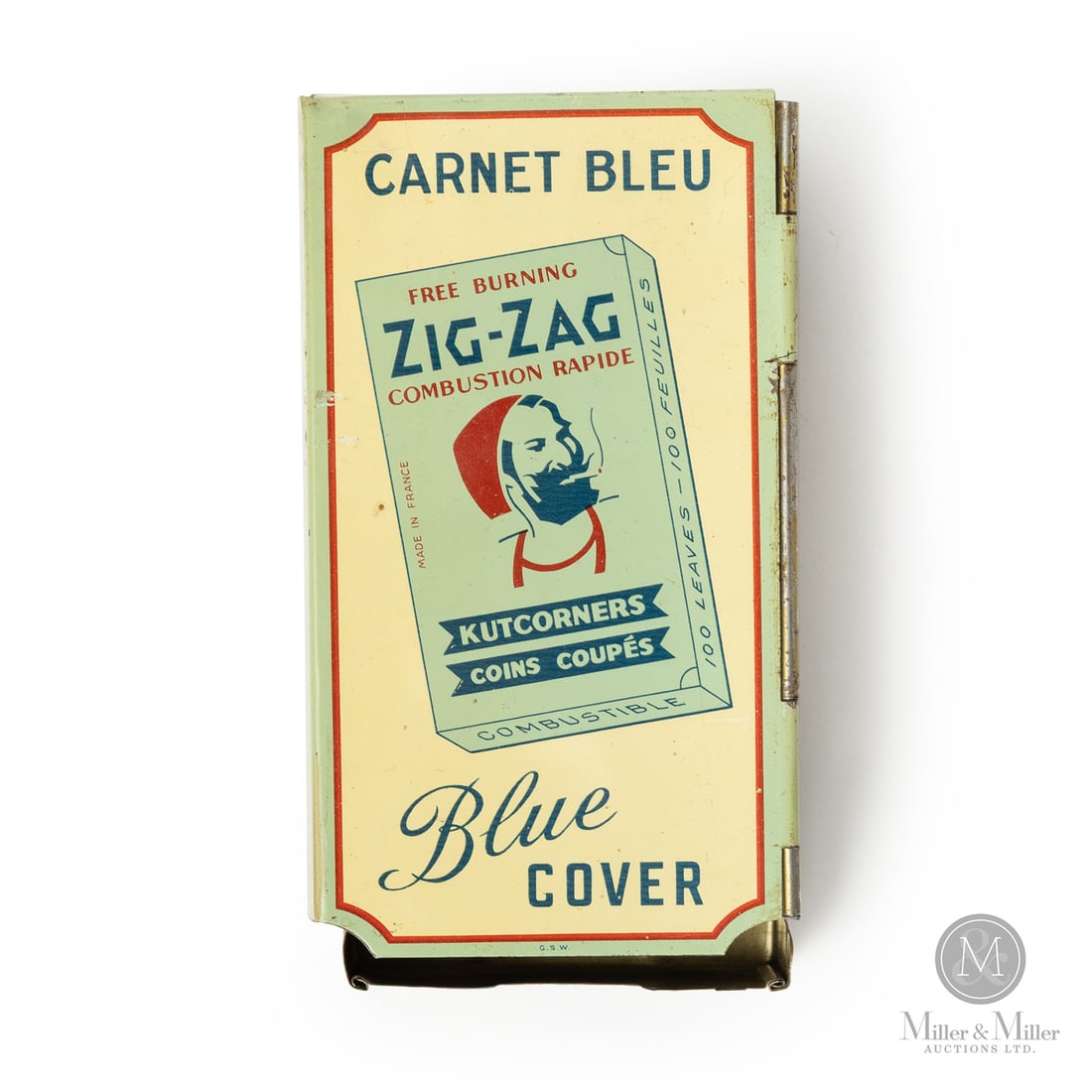 Zig-Zag Blue Cover Cigarette Paper Dispenser: Canadian. 1940s. Lithographed tin. Zig Zag cigarette papers were named for the "Z" shape of the tobacco leaves, which were folded in two and interleaved (alternately placed between one another) as