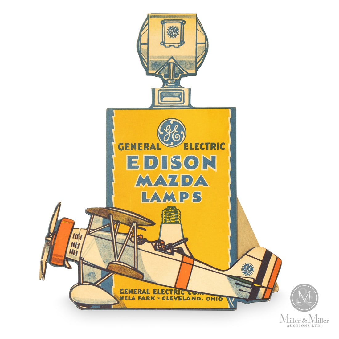 General Electric Edison Mazda Lamps Easel Sign: U.S.A. 1930s. Lithographed cardboard. This is a window or counter display featuring an early biplane. With aviation rapidly progressing during the era, General Electric placed their light bulb in the