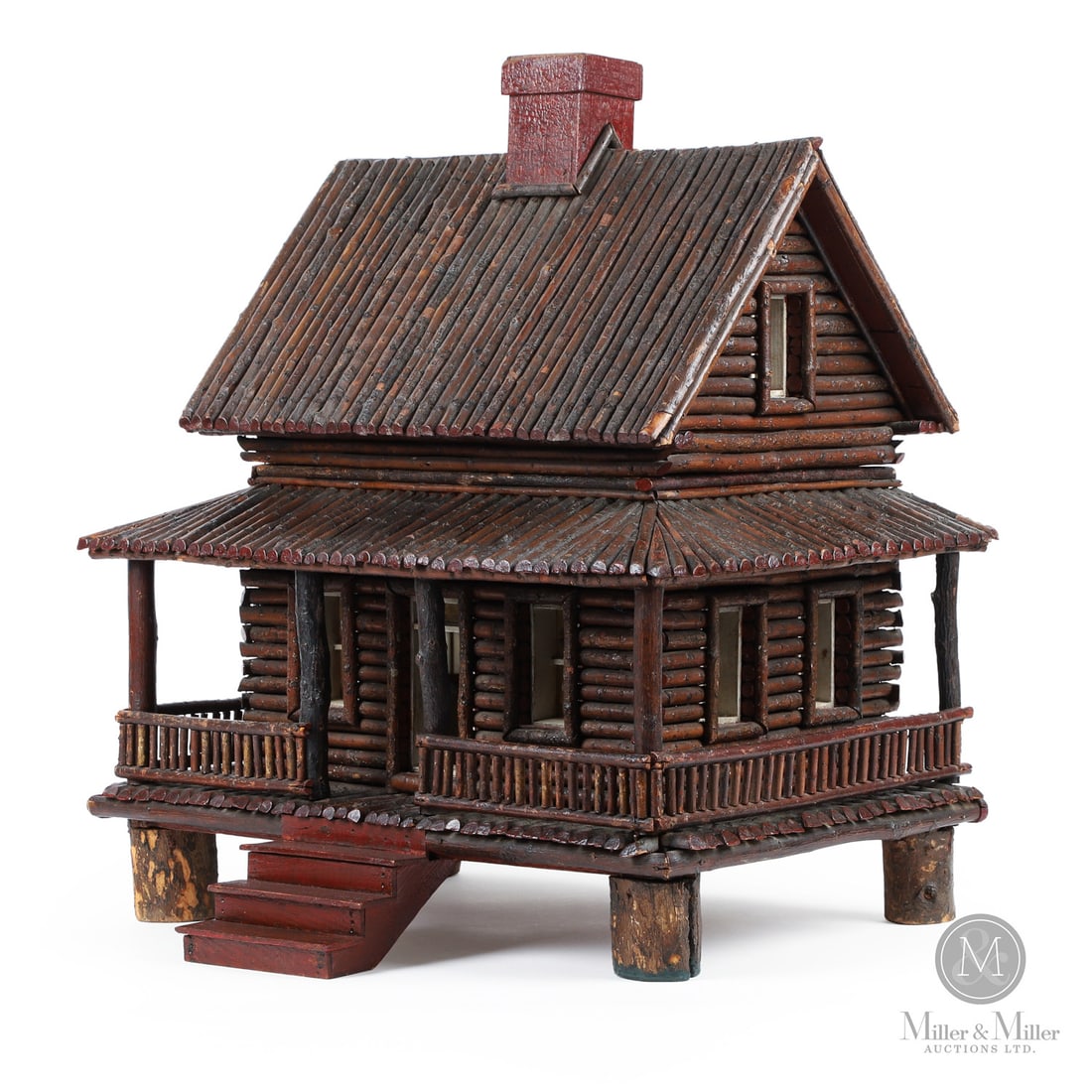 Folk Art Log Cabin: Quebec, Canada. c. 1920. Wood. A finely crafted two-storey log cabin with wrap-around porch, having great colour, form and overall condition. Note the chimney in original red paint. The top lifts off
