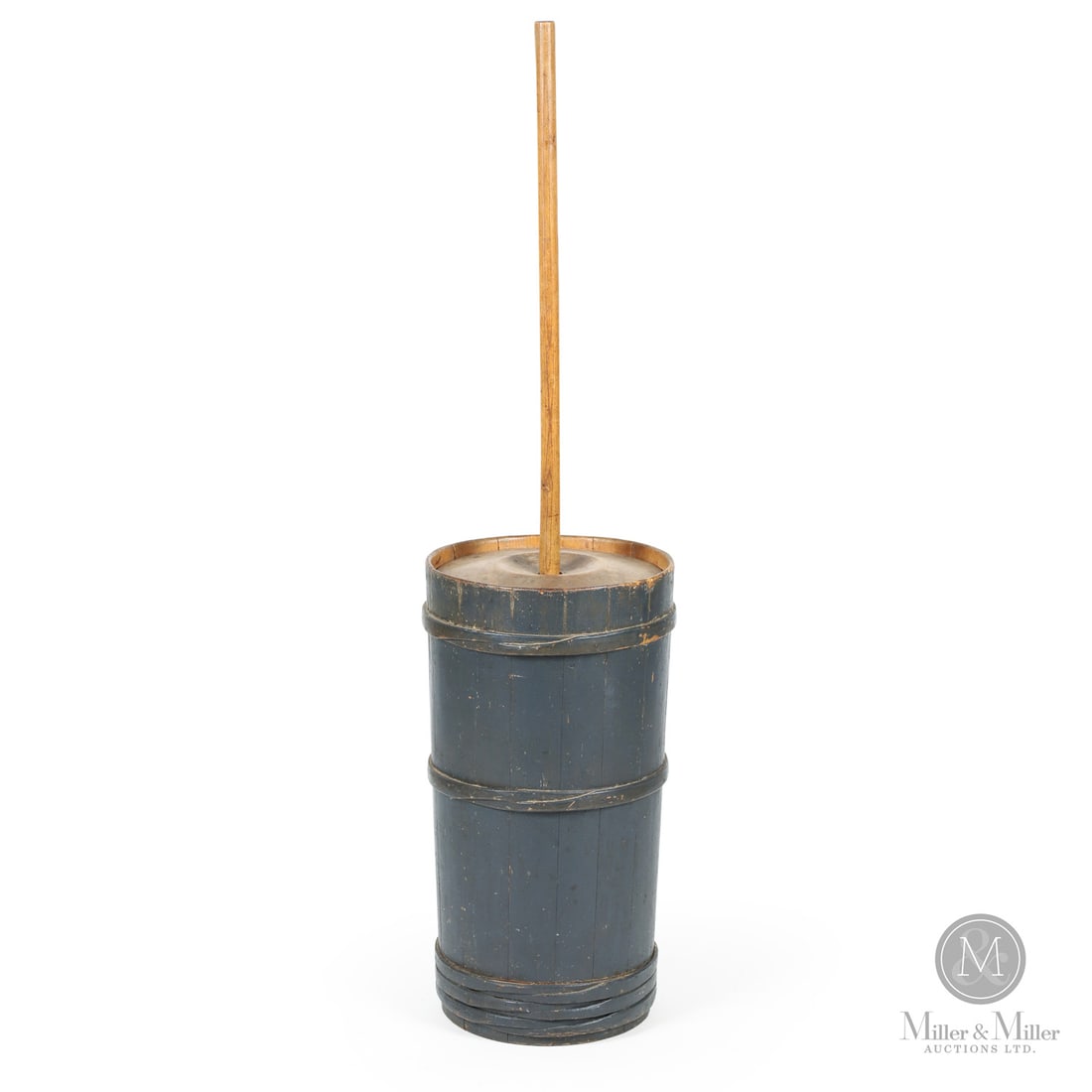 Early Blue Butter Churn: Canada. c. 1880-1910. Wood. An early staved butter churn with finger-lapped bands and in grey-blue original paint. Includes original dasher. Unmarked. 53" x 13" (top diameter). From the Late Miller