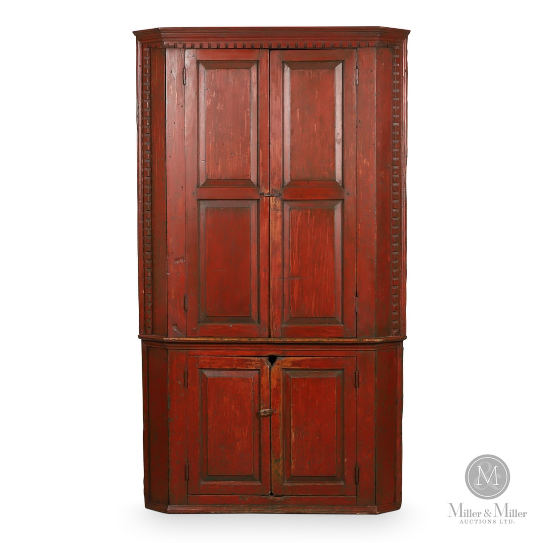 Quebec Six-Panel Corner Cupboard: Quebec, Canada. c 1830. Wood. A six-panel, four-door pine corner cupboard with a prominent dentil molding on the cornice and on both edges of the side returns on the upper section. One-piece construct