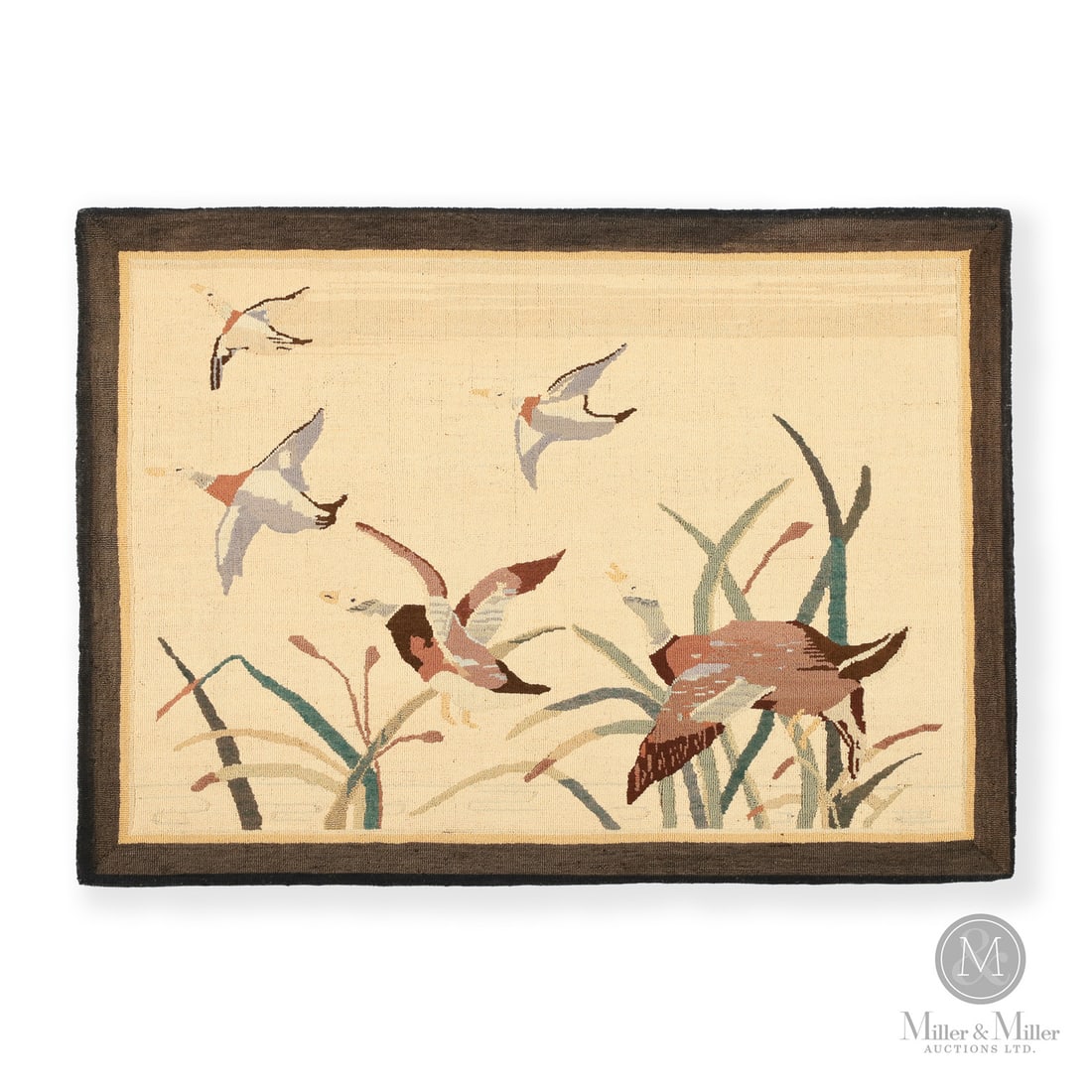 "Ducks in the Marsh" Grenfell Rug: Newfoundland & Labrador, Canada. Late Second Quarter 20th Century. Hooked Textile. A Grenfell hooked mat of mallards in flight with bull rushes in the foreground. Fitted with a hanging sleeve. Retains