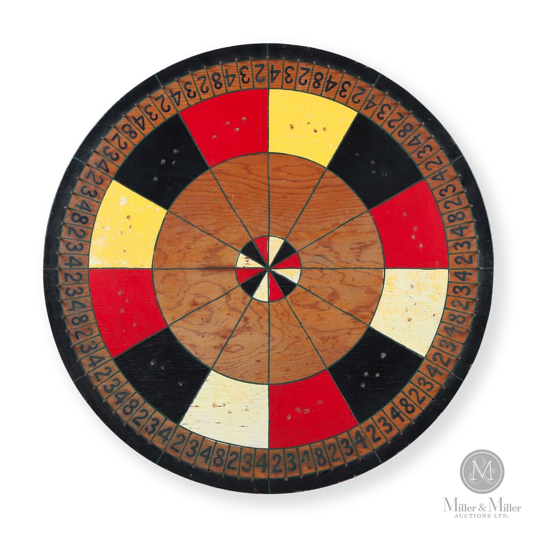 Carnival Gaming Wheel: Canada. Second Quarter 20th Century. Wood. A large carnival gaming wheel with strong design and colour. Laminated wood. Unmarked. 30" dia. x 1.5". From the Late Miller Carmichael Collection. Canada.