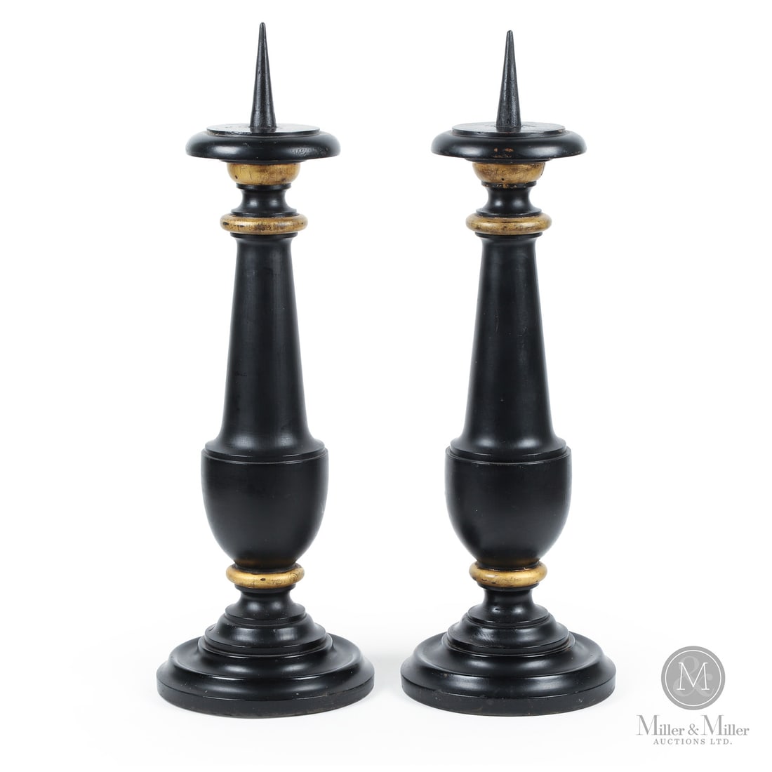 Quebec Candlesticks In Black Paint: Quebec, Canada. Late 19th Century. Wood. A pair of Quebec altar candlesticks with robust turned shafts and in original black and gold paint. Unmarked. 24.5" x 8.25" (base diameter). From the Late Mill
