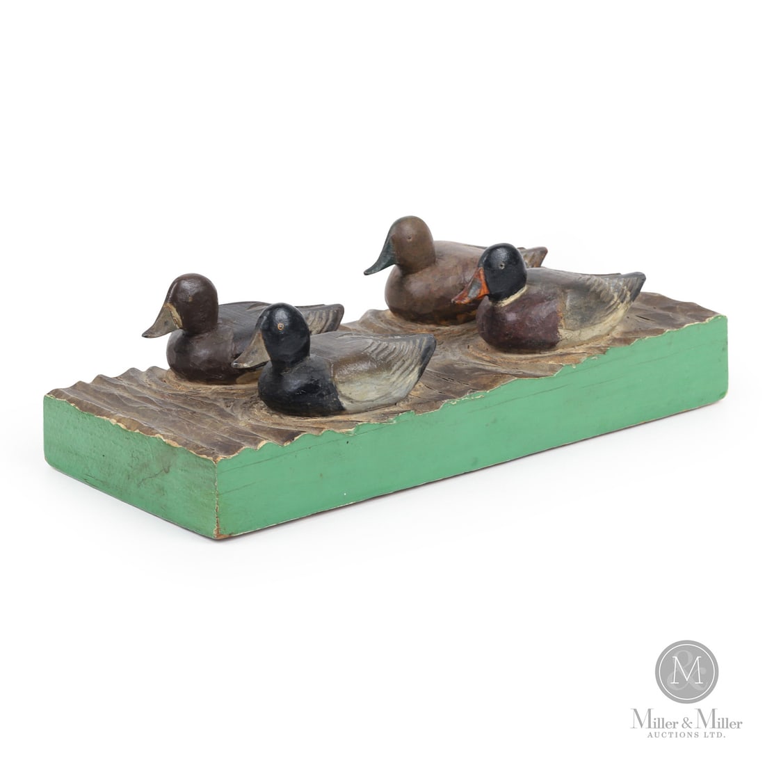 Miniature Gerald Therrien Bluebill and Mallard Carving: Quebec. Early second quarter 20th century. Painted wood. 2.25" x 7.75" x 3.25". From the Late Miller Carmichael Collection. Quebec. Early second quarter 20th century.