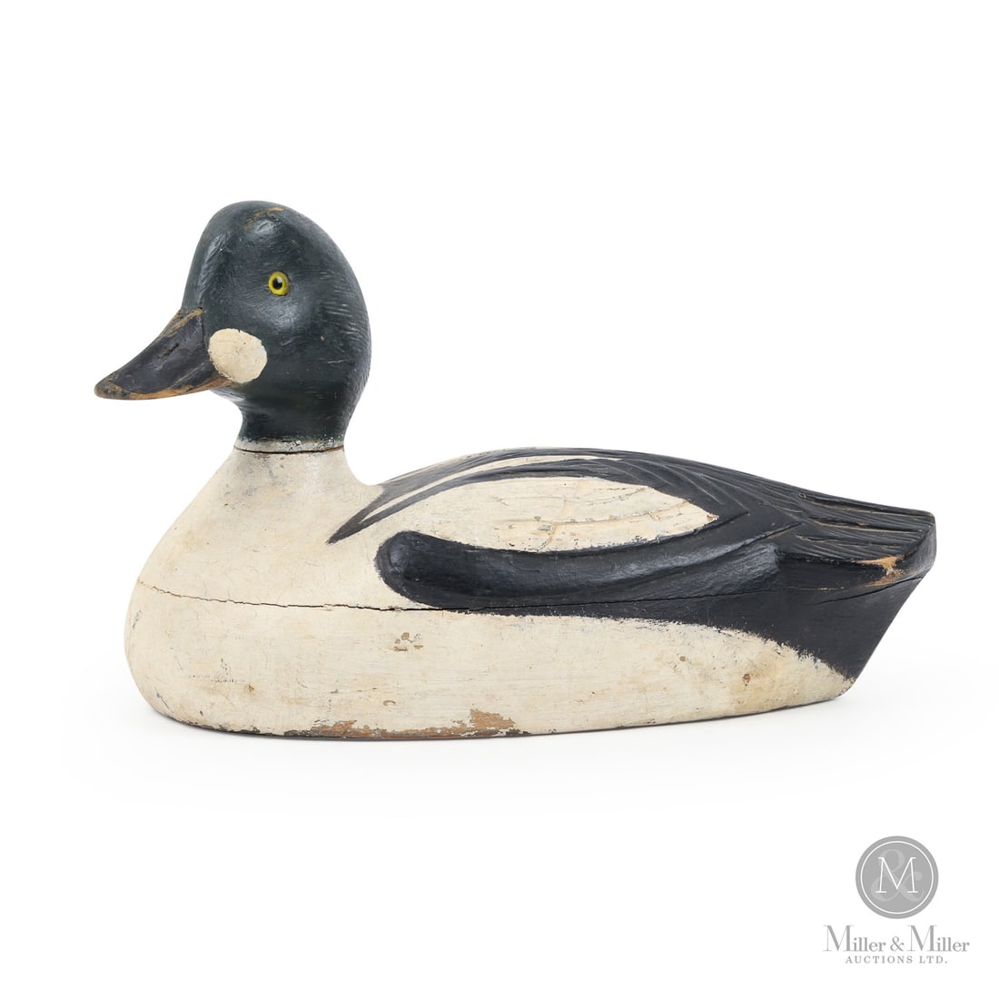 Bill Cooper (1886-1975) Goldeneye Decoy: Quebec. Second quarter 20th century. Painted wood. Stamped, "Clayton 7R6449", underneath. 7" x 11.75" x 5.75". From the Late Miller Carmichael Collection. Quebec. Second quarter 20th century. Stamped,