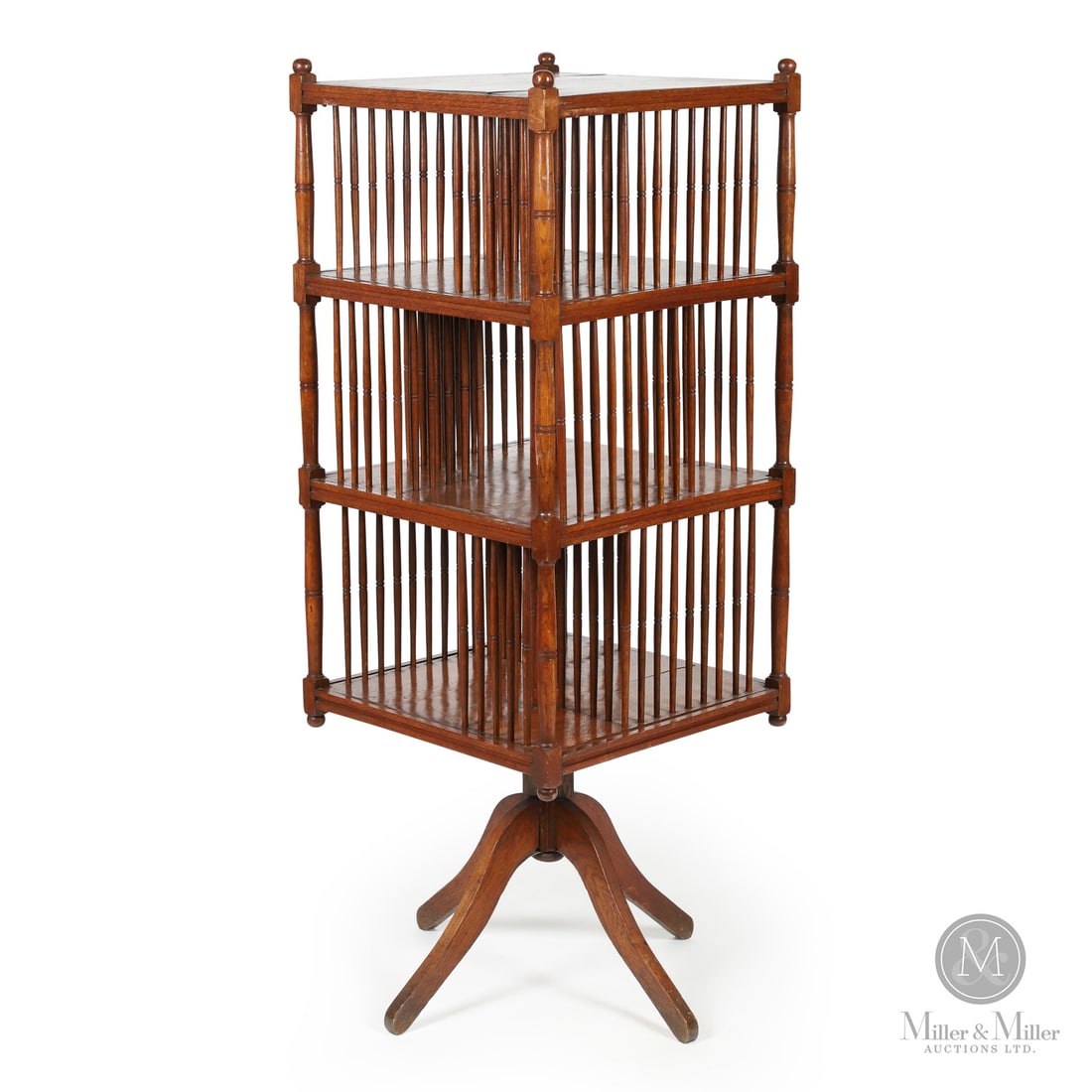 Three-Tier Revolving Bookcase: Canada. c. 1900. Wood. An antique revolving (spinning) library bookcase designed to provide high-density book storage in a compact, accessible format. The unit consists of three square open shelves