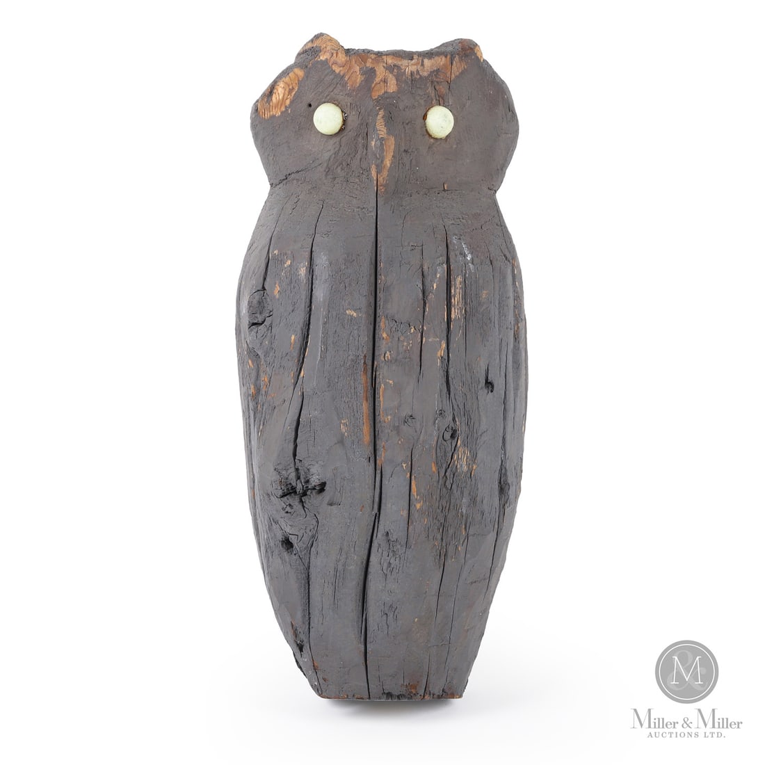 Rustic Folk Art Owl: Quebec, Canada. Early 20th Century. Wood. A primitive carved owl with white stone eyes and in original grey paint. Owls like this were often mounted on fence posts as garden "scarecrows". Unmarked. 17