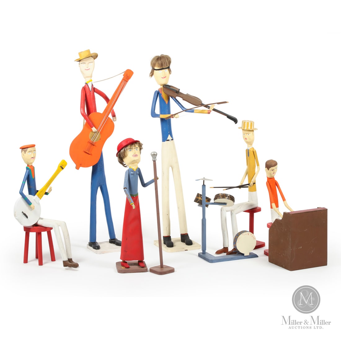 Harold Tutty "Coal Town Band": Canada. c. 1989. Wood. The "Coal Town Band" carved by Nova Scotia folk artist Harold Tutty including drummer, fiddler, banjo player, guitarist, piano player and a singer with a microphone. Each