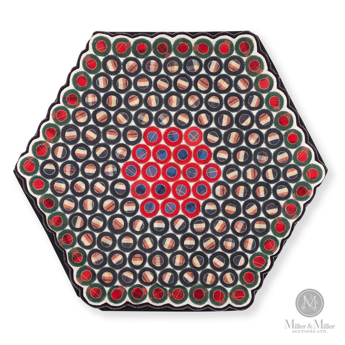 Hexagon Penny Rug: Quebec, Canada. c. 1920. Textile. A hexagonal penny mat with hand stitched, multi-colour felt discs. Unmarked. 37" x 41.5" x 1". From the Late Miller Carmichael Collection. Quebec, Canada. c. 1920. A