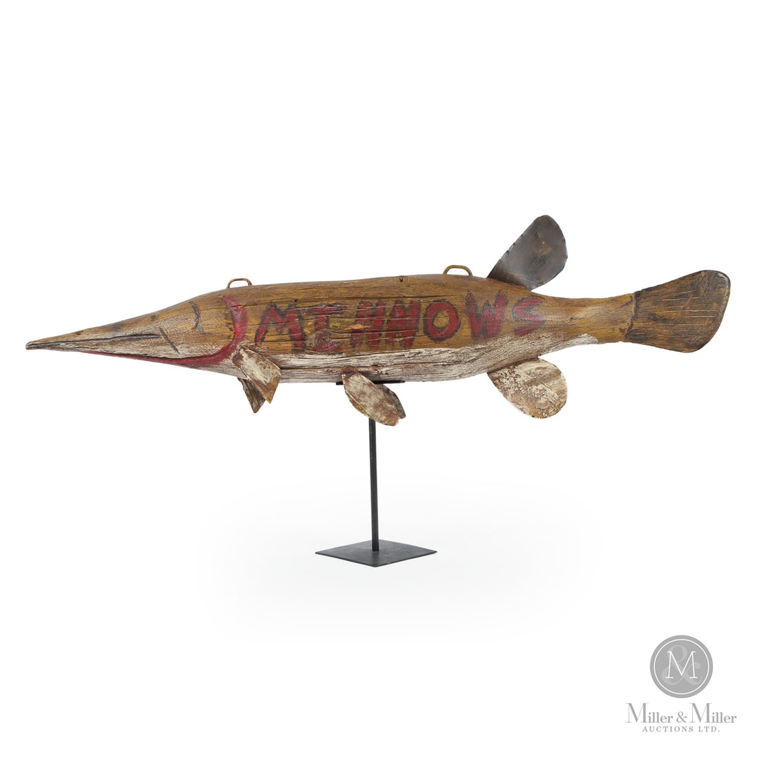 Folk Art Minnow Trade Sign: Canada. Fourth Quarter 20th Century. Wood. A bait shop sign in the shape of a pike carved from an old weathered pole, mounted with tin fins and painted in dark yellow with "Minnows" lettered in red an
