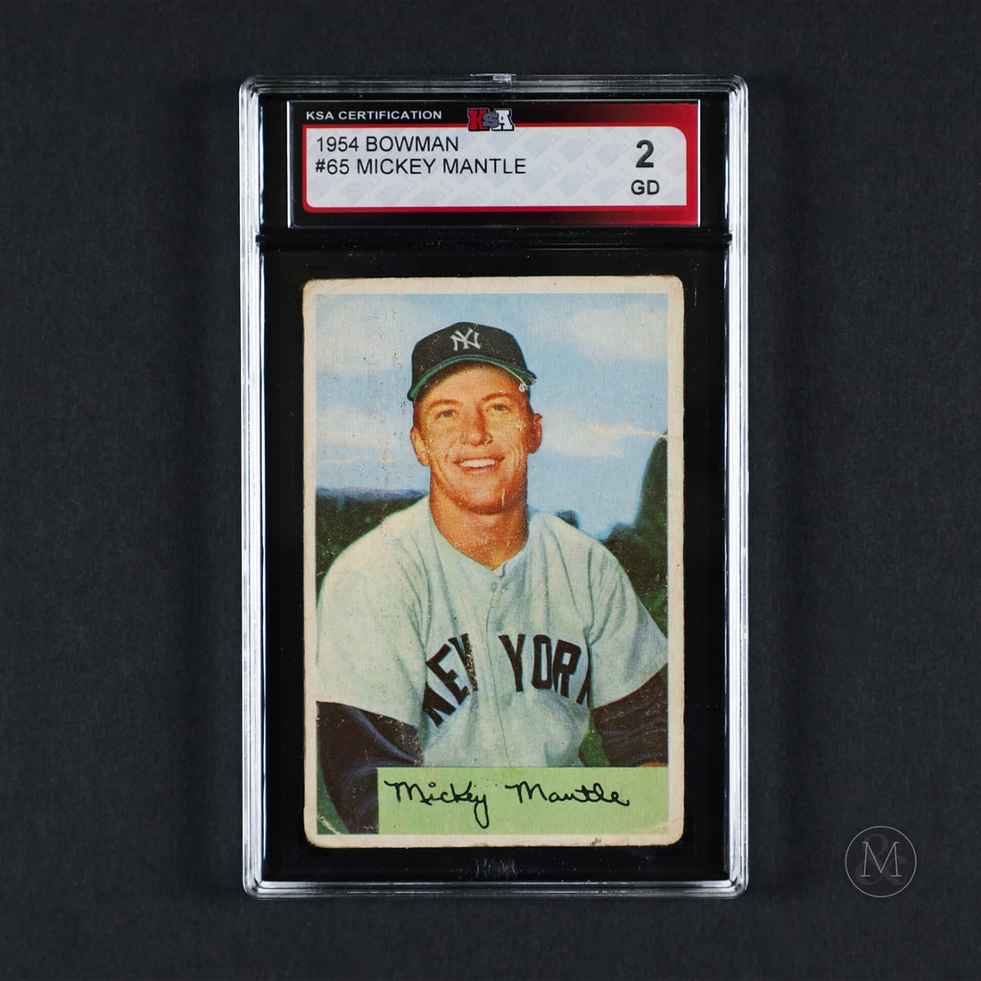 1954 Bowman #65 Mickey Mantle (KSA 2 G): The 1954 Bowman Mickey Mantle offered here was recently graded by KSA and represents Mickey Mantle in his fourth playing year. Mickey Mantle amassed 536 career home runs and 1,509 RBIs while