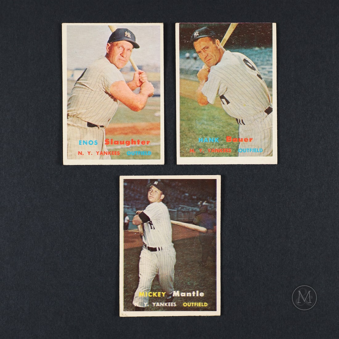 1957 Topps Mantle, Slaughter, Bauer: The trio of 1957 Topps baseball cards offered here include legendary Yankee Mickey Mantle, hall of fame inductee Enos Slaughter and noteable Yankee Hank Bauer. All items are guaranteed authentic by Mi